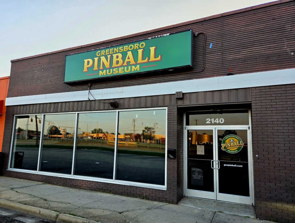 Greensboro: Big, Unexpected Adventures From 1781 Battlefield to Jeansboro 32 Storefront entrance to the Greensboro Pinball Museum.