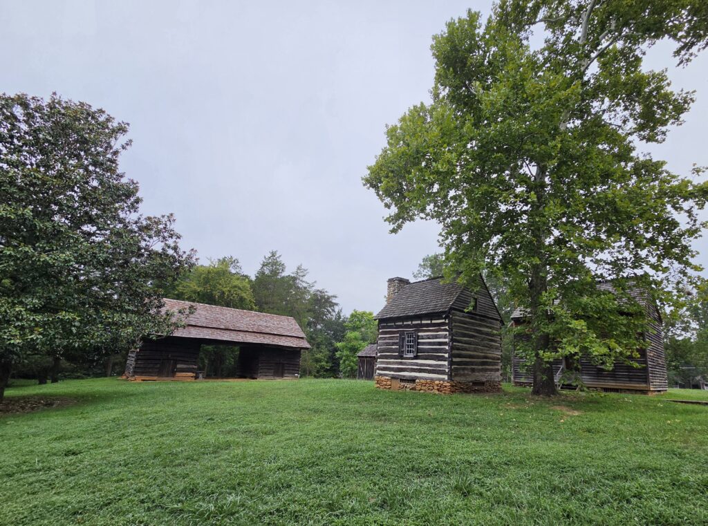 Greensboro: Big, Unexpected Adventures From 1781 Battlefield to Jeansboro 15 Barn and log house on the Hoskins farmstead in Greensboro.