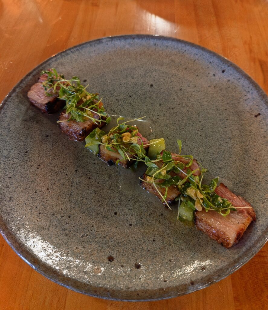 Greensboro: Big, Unexpected Adventures From 1781 Battlefield to Jeansboro 41 Pork Belly pieces rolled up in melon.