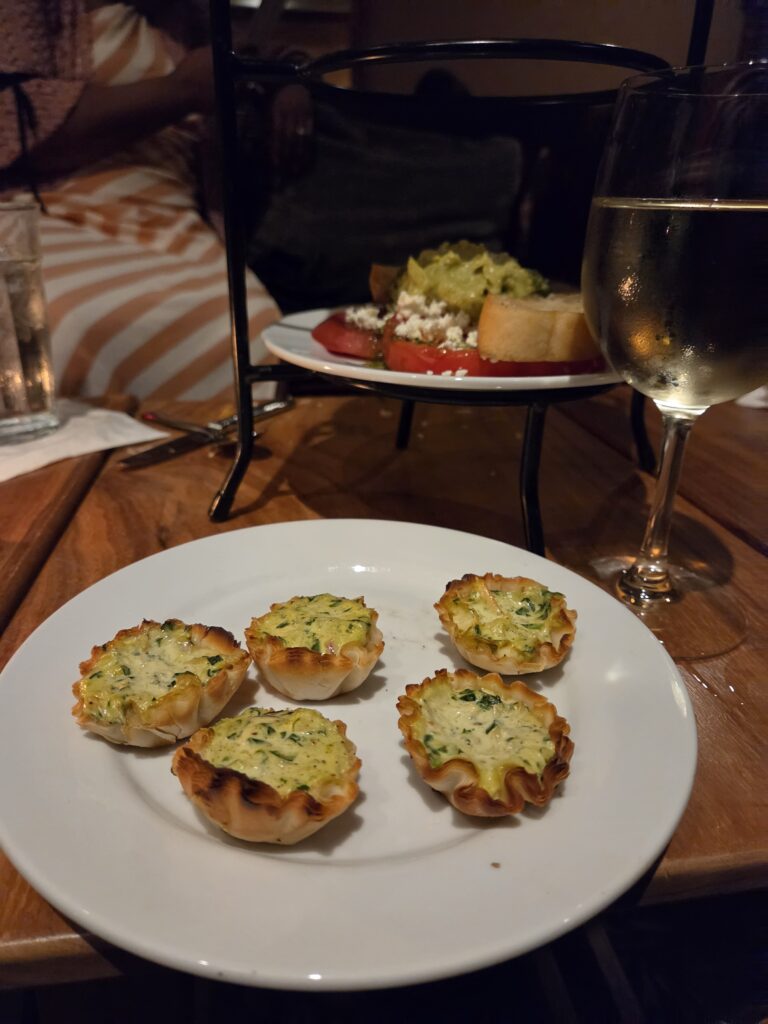Greensboro: Big, Unexpected Adventures From 1781 Battlefield to Jeansboro 45 Plate with blue cheese and crab tartlets.