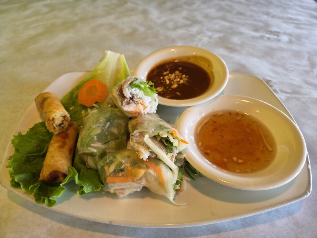Greensboro: Big, Unexpected Adventures From 1781 Battlefield to Jeansboro 36 Three different spring rolls and a bowl of dipping sauce.